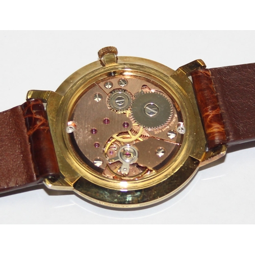 1334 - A vintage Garrard gold plated watch with mechanical movement, crocodile effect leather strap and ori... 