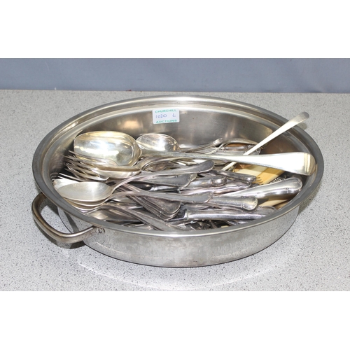 1020l - A large qty of assorted silver plated cutlery, some with silver collars, in stainless steel cooking ... 