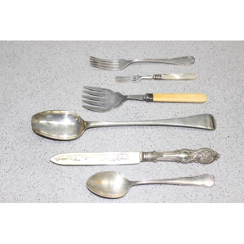 1020l - A large qty of assorted silver plated cutlery, some with silver collars, in stainless steel cooking ... 