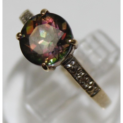 1119 - A vintage 9ct gold cocktail ring with facet cut central stone flanked by illusion set diamond should... 