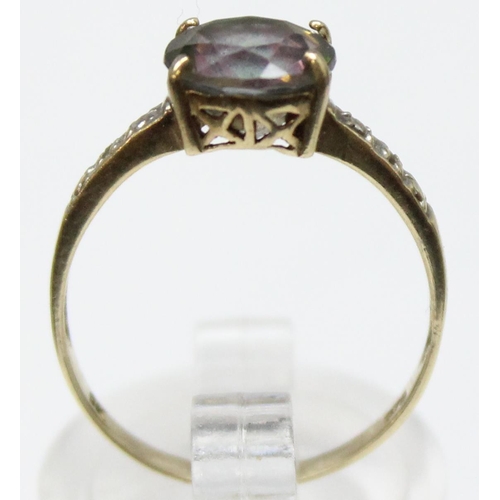 1119 - A vintage 9ct gold cocktail ring with facet cut central stone flanked by illusion set diamond should... 