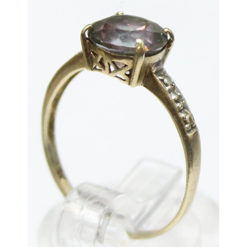 1119 - A vintage 9ct gold cocktail ring with facet cut central stone flanked by illusion set diamond should... 