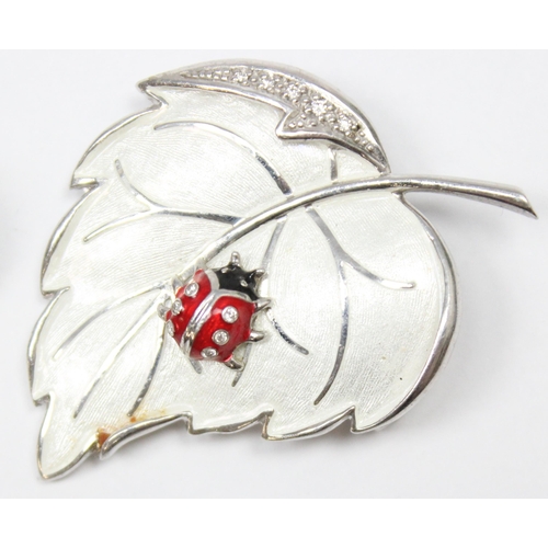 1127 - A vintage Nicole Barr silver and enamel leaf brooch with ladybird, 2 silver and enamel brooches of a... 