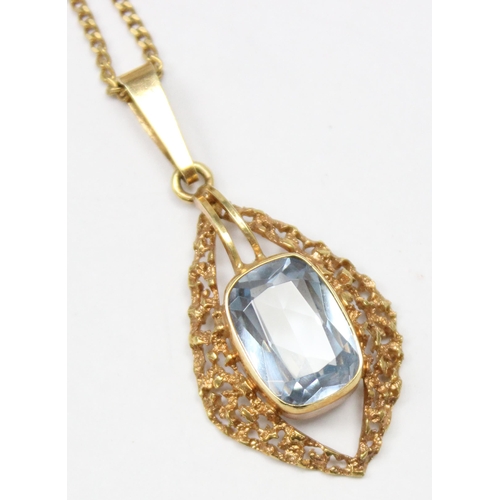 1138 - A vintage 9ct gold retro style pendant with facet cut blue stone centre on 9ct gold kerb link chain,... 