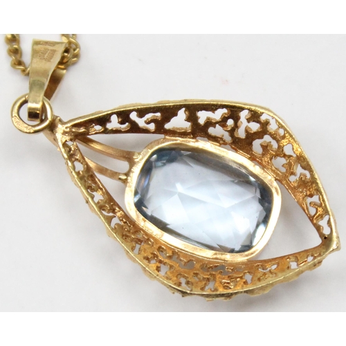 1138 - A vintage 9ct gold retro style pendant with facet cut blue stone centre on 9ct gold kerb link chain,... 