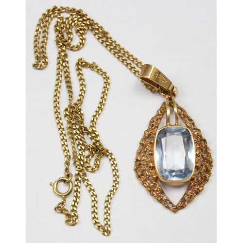 1138 - A vintage 9ct gold retro style pendant with facet cut blue stone centre on 9ct gold kerb link chain,... 