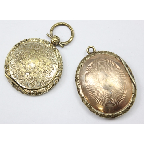 1149 - 2 antique gold plated lockets with engraved decorations, the largest approx 39mm x 29mm