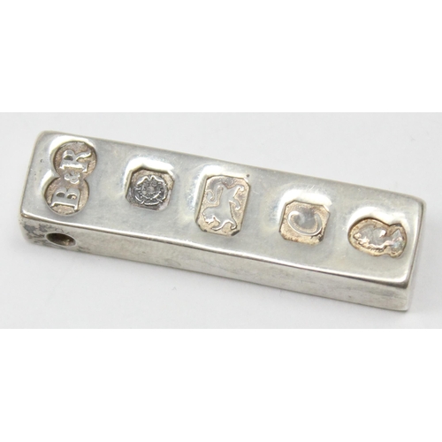 1150 - A vintage hallmarked silver ingot, Sheffield 1977, with pierced hole for chain mount, approx 21.37g ... 