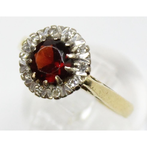 1167 - An 18ct gold diamond and garnet ring, marked for Birmingham 1993 and XRF confirmed, also marked Star... 