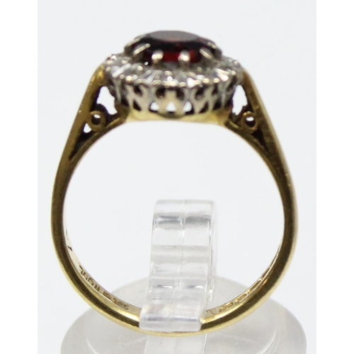 1167 - An 18ct gold diamond and garnet ring, marked for Birmingham 1993 and XRF confirmed, also marked Star... 