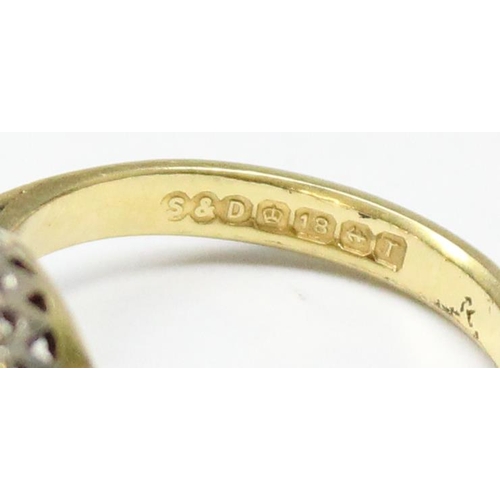 1167 - An 18ct gold diamond and garnet ring, marked for Birmingham 1993 and XRF confirmed, also marked Star... 