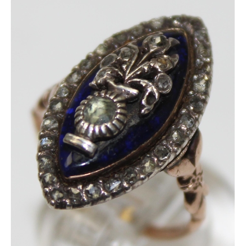 1189 - A Georgian diamond and blue enamel navette ring, a border of small diamonds surround the blue enamel... 