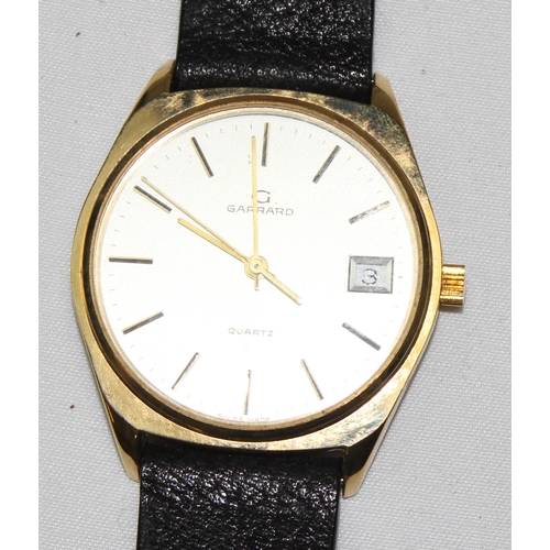 1314 - A vintage Garrards quartz watch in gold plated case with leather strap, displayed in original box, t... 