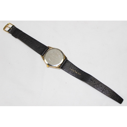 1314 - A vintage Garrards quartz watch in gold plated case with leather strap, displayed in original box, t... 