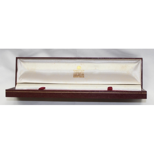 1314 - A vintage Garrards quartz watch in gold plated case with leather strap, displayed in original box, t... 