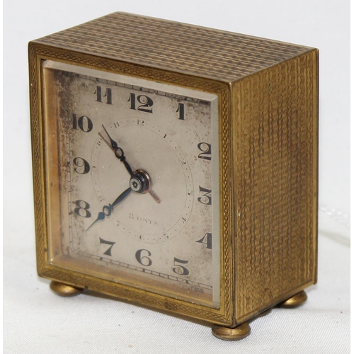 1320 - A small vintage Swiss made gilt metal cased alarm clock, approx 52mm wide, no maker