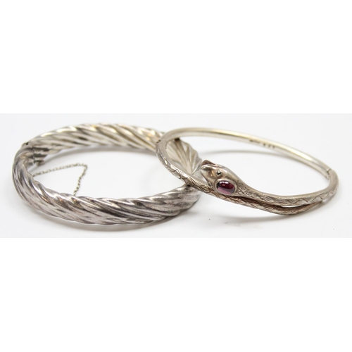 1120V - 2 vintage silver bangles, one formed as a snake with green cabochon stone and another twisted silver... 