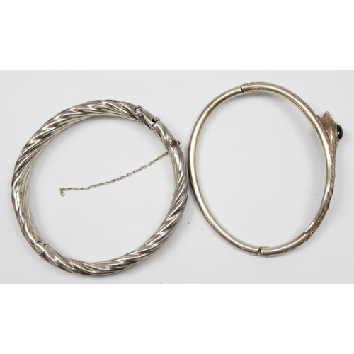 1120V - 2 vintage silver bangles, one formed as a snake with green cabochon stone and another twisted silver... 