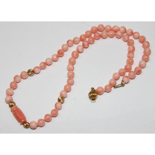 1120T - A 14ct gold and pink coral bead necklace, the clasp marked 14kt and XRF confirmed on clasp and balls... 