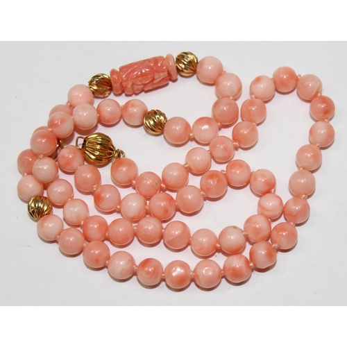 1120T - A 14ct gold and pink coral bead necklace, the clasp marked 14kt and XRF confirmed on clasp and balls... 