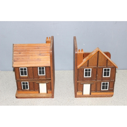 299D - Pair of wooden model house bookends with hidden drawers, approx height 23cm