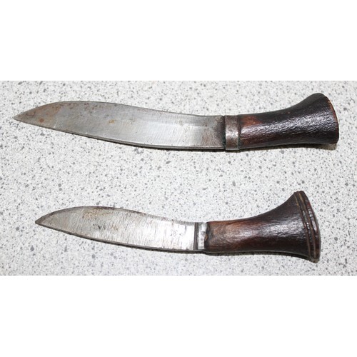 1410 - Vintage Kukri knife in wooden scabbard with two incorporated sharpening knives, and a pair of touris... 