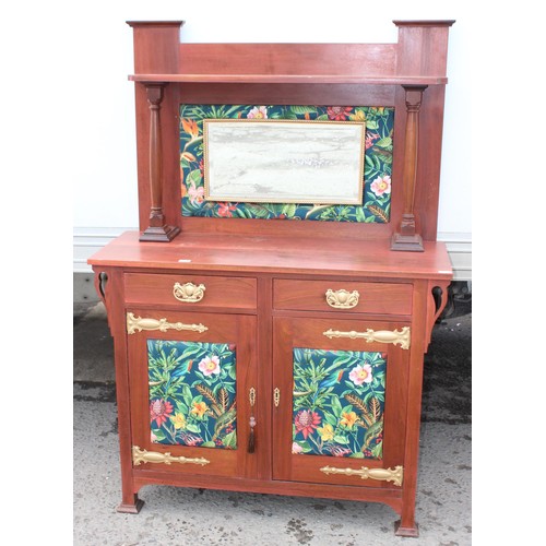 13 - An antique mahogany sideboard with later decorative fabric panels and gold painted strap hinges, app... 