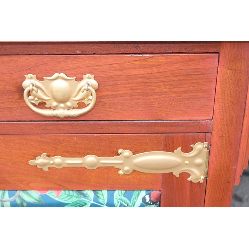 13 - An antique mahogany sideboard with later decorative fabric panels and gold painted strap hinges, app... 