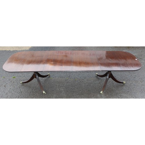 44 - A large antique style mahogany pedestal dining table, approx 212cm wide (310cm fully extended) x 100... 