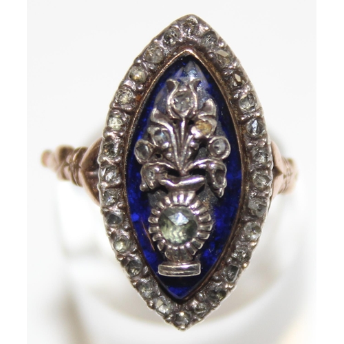 1189 - A Georgian diamond and blue enamel navette ring, a border of small diamonds surround the blue enamel... 