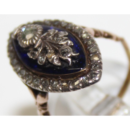 1189 - A Georgian diamond and blue enamel navette ring, a border of small diamonds surround the blue enamel... 