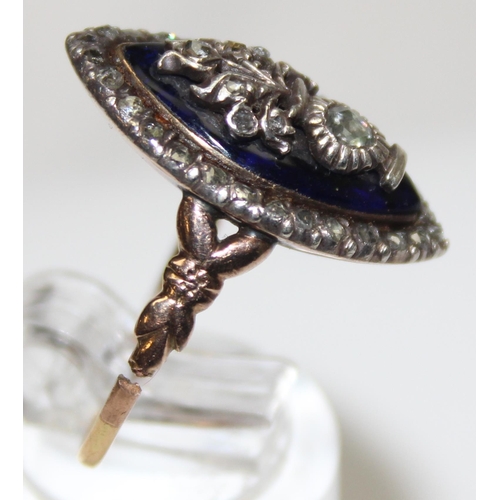 1189 - A Georgian diamond and blue enamel navette ring, a border of small diamonds surround the blue enamel... 