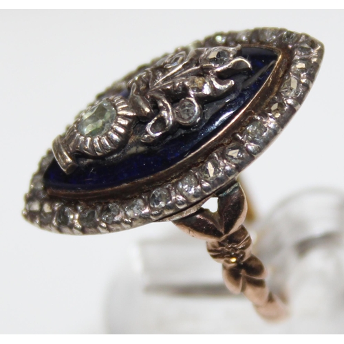 1189 - A Georgian diamond and blue enamel navette ring, a border of small diamonds surround the blue enamel... 