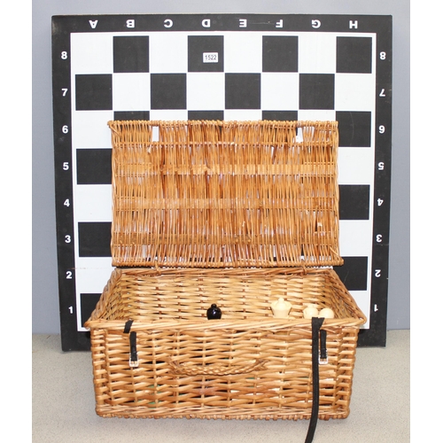 1522 - Garden chess set in wicker basket, chess board with table base approx 90cm wide x 90cm deep x 74cm t... 