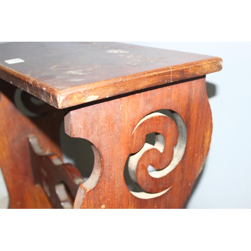 197 - A high piano or organ stool with fretwork carved details, approx 65cm wide x 26cm deep x 61cm tall