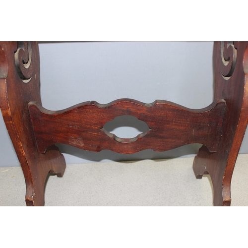 197 - A high piano or organ stool with fretwork carved details, approx 65cm wide x 26cm deep x 61cm tall