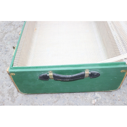 84 - A vintage green wooden ribbed shipping trunk, approx 92cm wide x 54cm deep x 31cm tall