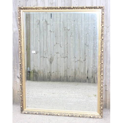 481 - A large decorative gilt framed mirror, approx 135cm x 104cm