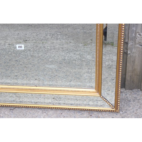 490 - A modern gilt and stepped glass framed mirror, approx 103cm x 79cm