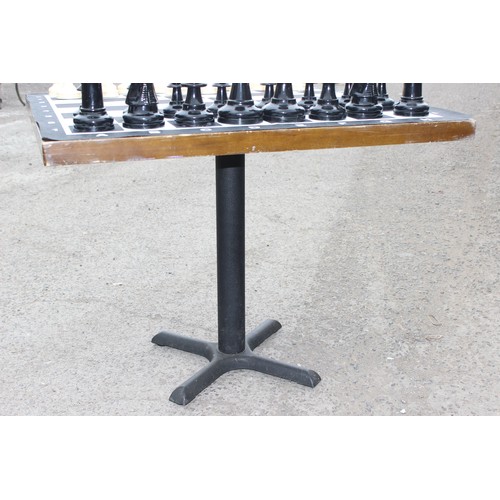 1522 - Garden chess set in wicker basket, chess board with table base approx 90cm wide x 90cm deep x 74cm t... 