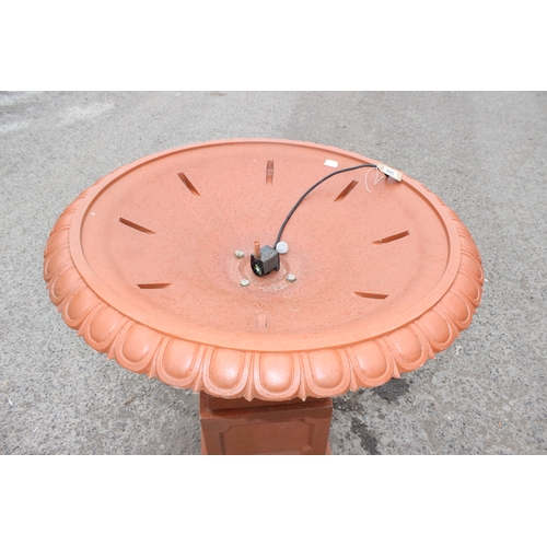 388 - A large classical style terracotta coloured garden fountain formed as a classical urn, ideal planter... 