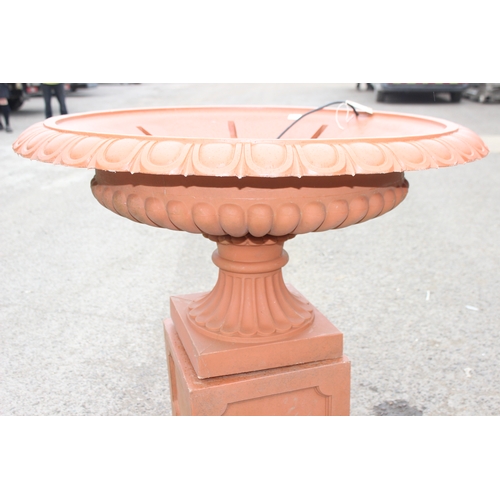 388 - A large classical style terracotta coloured garden fountain formed as a classical urn, ideal planter... 