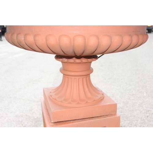 388 - A large classical style terracotta coloured garden fountain formed as a classical urn, ideal planter... 