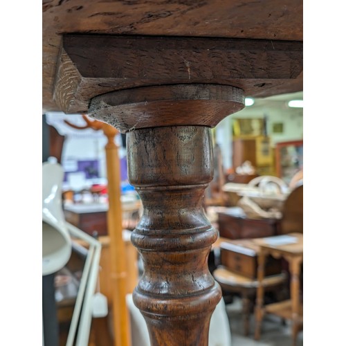 21 - An unusual antique side table with burrwood top, possibly Elm, on pedestal base, approx 41cm diamete... 