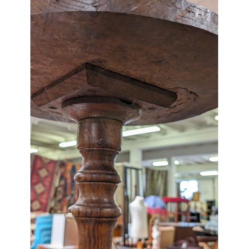 21 - An unusual antique side table with burrwood top, possibly Elm, on pedestal base, approx 41cm diamete... 