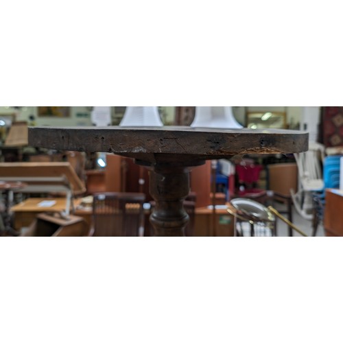 21 - An unusual antique side table with burrwood top, possibly Elm, on pedestal base, approx 41cm diamete... 