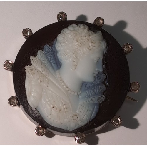 1164 - An 18ct gold and diamond set cameo brooch carved with and Elizabethan female bust, indistinctly mark... 