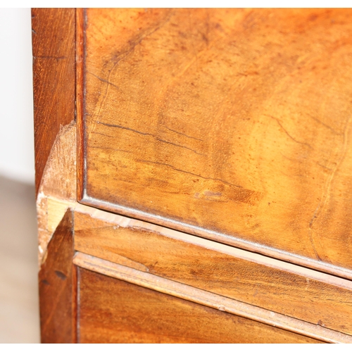 95 - A George III mahogany Secrétaire bookcase, with astragal glazed doors above 5 drawers, the top 2 fit... 