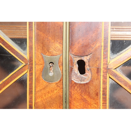 95 - A George III mahogany Secrétaire bookcase, with astragal glazed doors above 5 drawers, the top 2 fit... 