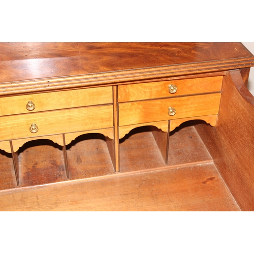 95 - A George III mahogany Secrétaire bookcase, with astragal glazed doors above 5 drawers, the top 2 fit... 